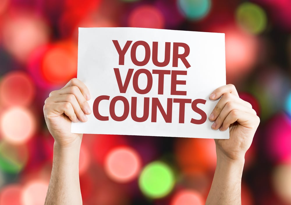 Your Vote Counts card with colorful background with defocused lights